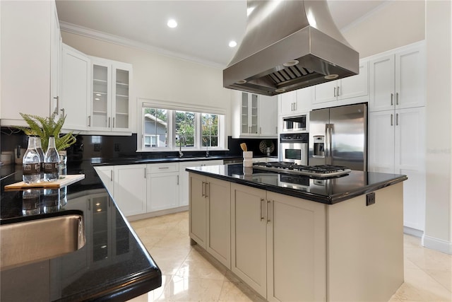1010 Terrace Blvd, Orlando, FL 32803 - kitchen featuring island range hood, stainless steel appliances, decorative backsplash, ornamental molding, and glass insert cabinets