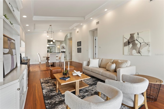 1010 Terrace Blvd, Orlando, FL 32803 - living room with arched walkways, crown molding, recessed lighting, dark wood-type flooring, and a tray ceiling