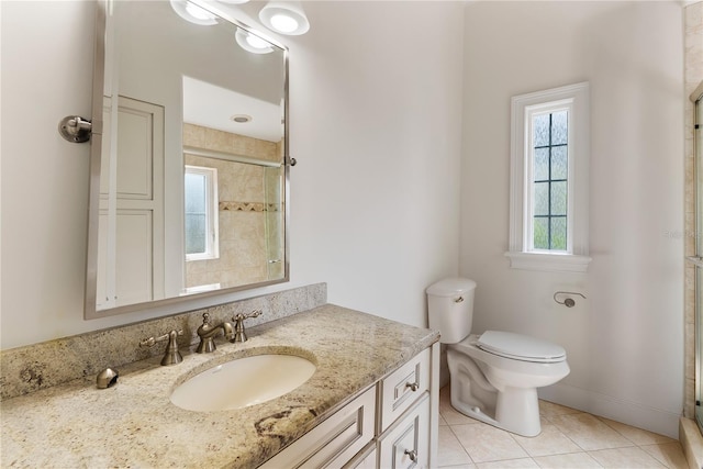 1010 Terrace Blvd, Orlando, FL 32803 - bathroom featuring tile patterned flooring, toilet, tiled shower, and vanity