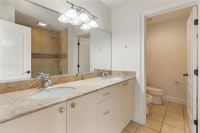 1010 Terrace Blvd, Orlando, FL 32803 - full bath with tile patterned floors, toilet, double vanity, tiled shower, and baseboards