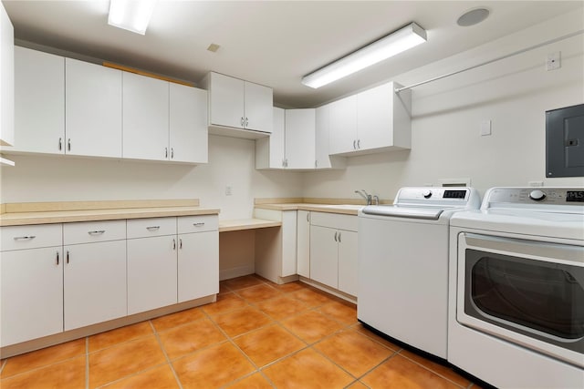 1010 Terrace Blvd, Orlando, FL 32803 - washroom featuring electric panel, washing machine and dryer, light tile patterned floors, and cabinet space