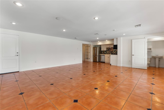 1010 Terrace Blvd, Orlando, FL 32803 - unfurnished living room featuring recessed lighting and light tile patterned flooring