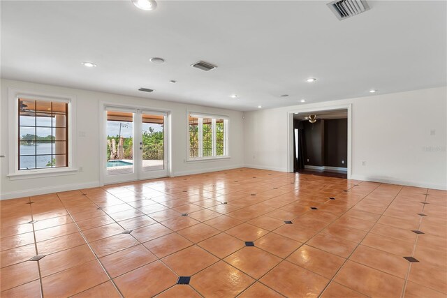 1010 Terrace Blvd, Orlando, FL 32803 - unfurnished room featuring light tile patterned flooring, baseboards, and recessed lighting