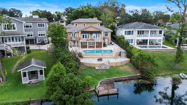 1010 Terrace Blvd, Orlando, FL 32803 - back of house featuring a balcony, a residential view, an outdoor pool, a patio, and a chimney