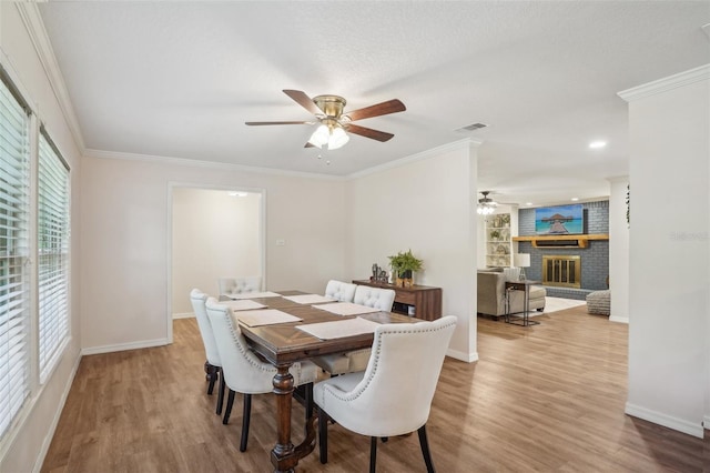 921 Torchwood Dr, Deland, FL 32724 - dining room with ceiling fan, wood finished floors, baseboards, and crown molding