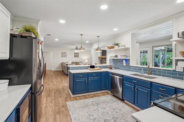 921 Torchwood Dr, Deland, FL 32724 - kitchen featuring stainless steel appliances, open shelves, blue cabinets, a sink, and recessed lighting