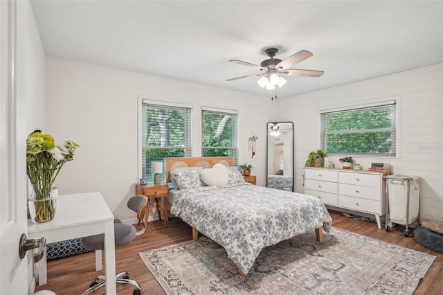 921 Torchwood Dr, Deland, FL 32724 - bedroom with multiple windows, wood finished floors, and a ceiling fan