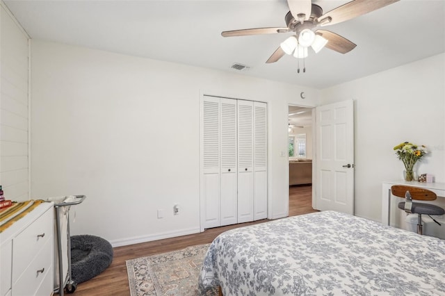921 Torchwood Dr, Deland, FL 32724 - bedroom with wood finished floors, a closet, a ceiling fan, and baseboards