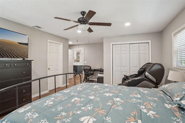 921 Torchwood Dr, Deland, FL 32724 - bedroom featuring a closet, wood finished floors, ceiling fan, recessed lighting, and a desk