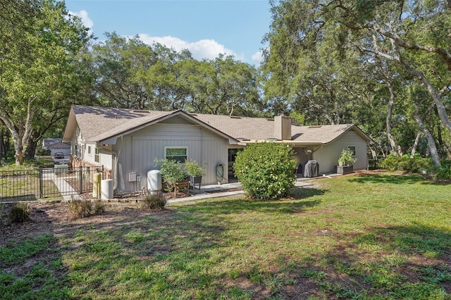 921 Torchwood Dr, Deland, FL 32724 - back of house with a chimney