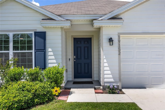 doorway to property featuring an attached garage