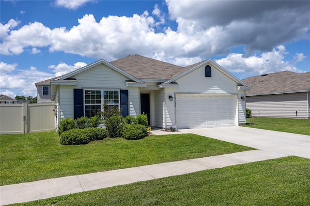 ranch-style home featuring an attached garage and driveway
