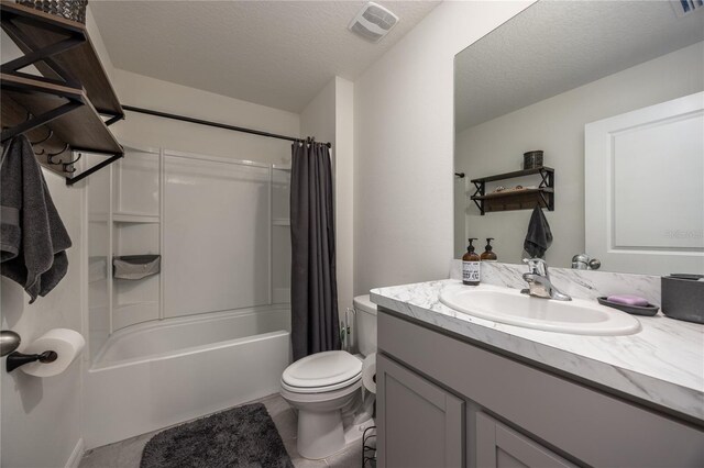 full bathroom with toilet, vanity, shower / bath combo, and a textured ceiling