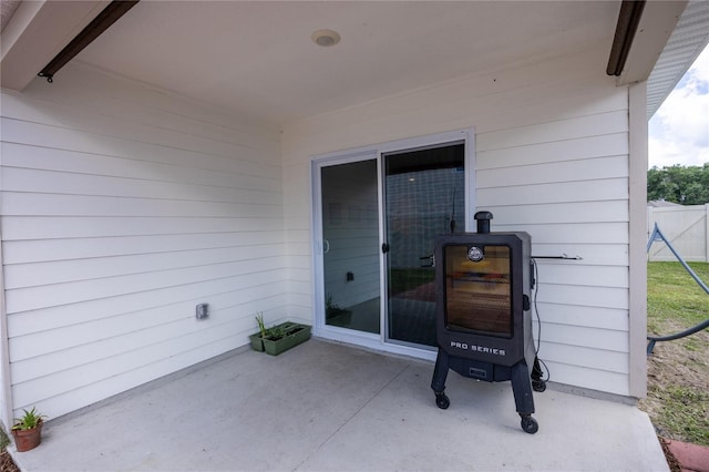 view of patio featuring fence