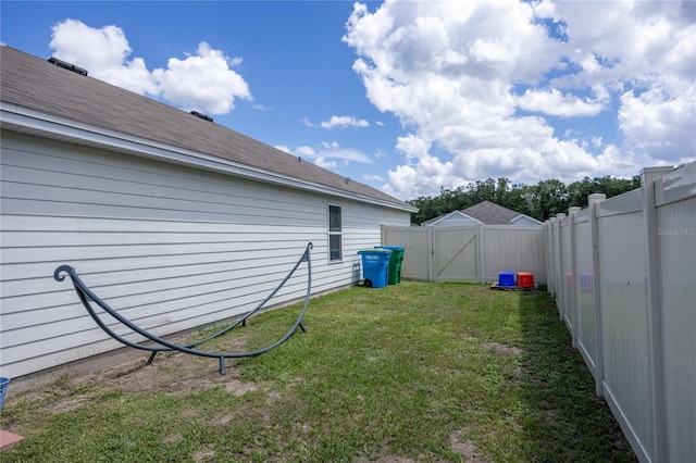 view of yard with a gate