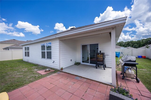 back of property with a patio area