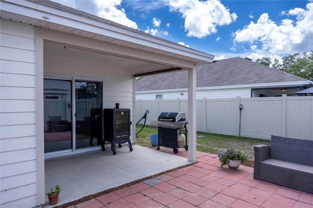 view of patio with fence and grilling area