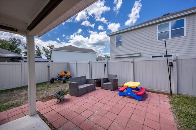 view of patio with a fenced backyard and a gate