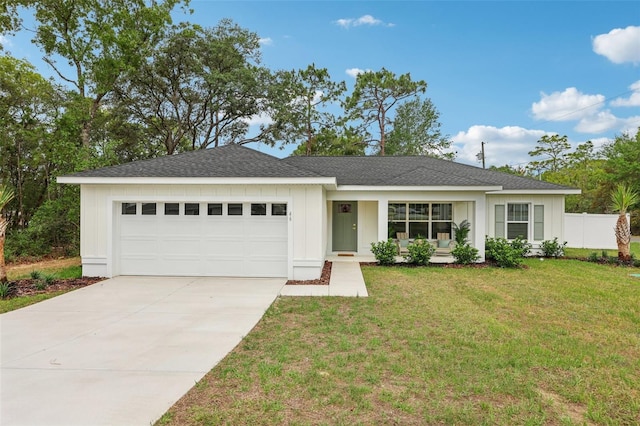 ranch-style house with an attached garage, concrete driveway, a shingled roof, and board and batten siding