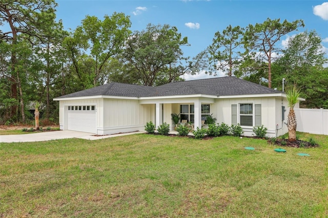 ranch-style home featuring a garage and concrete driveway