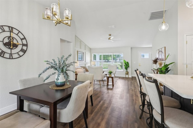 dining area with dark wood-style flooring, a chandelier, a ceiling fan, baseboards, and high vaulted ceiling