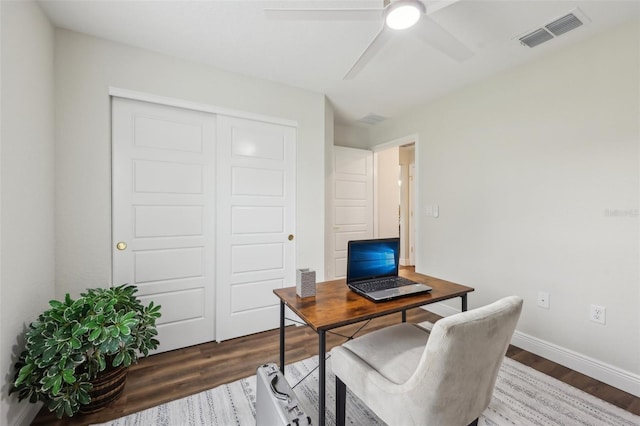 home office with wood finished floors, ceiling fan, and baseboards