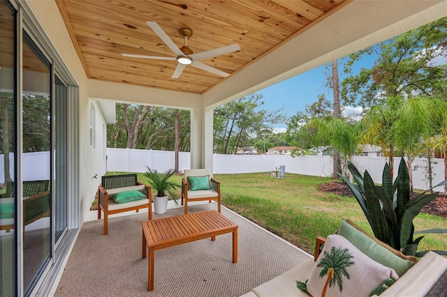 view of patio with a ceiling fan and an outdoor living space