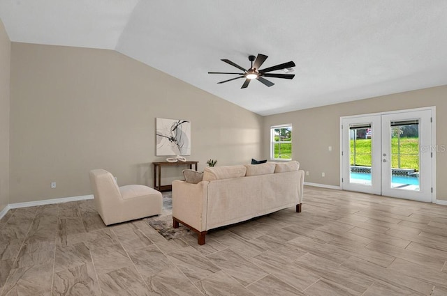 10545 Parkway Dr, Clermont, FL 34711 - living area featuring lofted ceiling, a ceiling fan, baseboards, and french doors