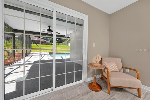 10545 Parkway Dr, Clermont, FL 34711 - doorway to outside with baseboards and ceiling fan