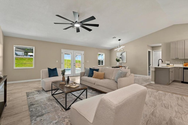 10545 Parkway Dr, Clermont, FL 34711 - living area with vaulted ceiling, baseboards, a ceiling fan, and french doors