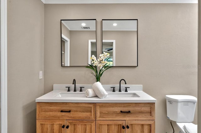 10545 Parkway Dr, Clermont, FL 34711 - bathroom with toilet, double vanity, and recessed lighting