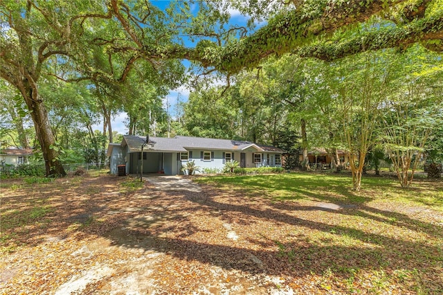 12046 SE 135th Ave, Ocklawaha, FL 32179 - view of yard featuring driveway, an attached carport, and fence
