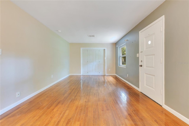 12046 SE 135th Ave, Ocklawaha, FL 32179 - unfurnished room with light wood finished floors and baseboards