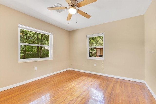 12046 SE 135th Ave, Ocklawaha, FL 32179 - unfurnished room featuring baseboards, light wood-style floors, and ceiling fan