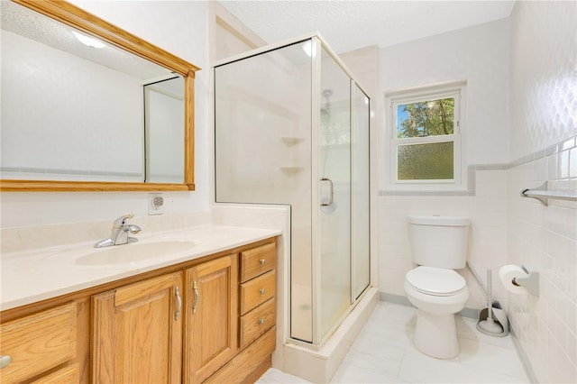 12046 SE 135th Ave, Ocklawaha, FL 32179 - bathroom with a shower stall, vanity, tile walls, toilet, and tile patterned floors