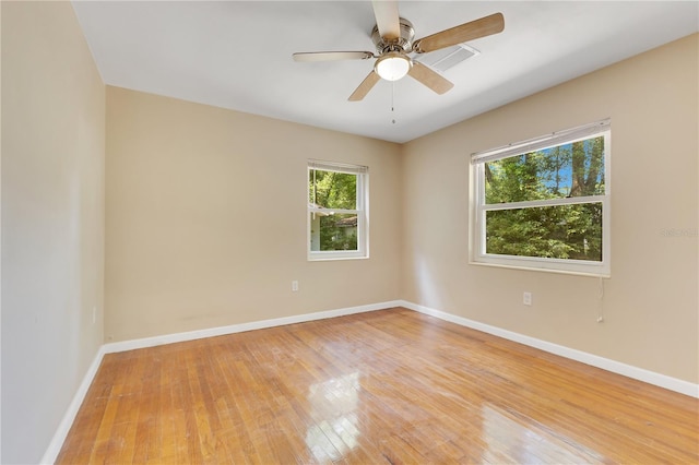 12046 SE 135th Ave, Ocklawaha, FL 32179 - unfurnished room with light wood-type flooring, baseboards, and a ceiling fan