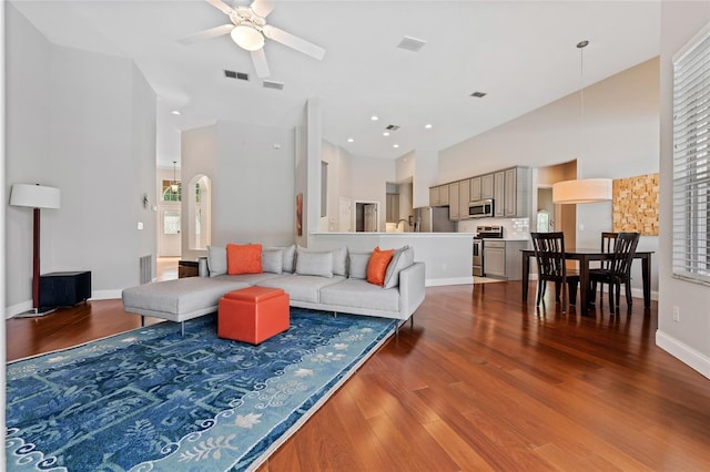 10030 Chatham Oaks Ct, Orlando, FL 32836 - living room with high vaulted ceiling, a ceiling fan, wood finished floors, baseboards, and recessed lighting