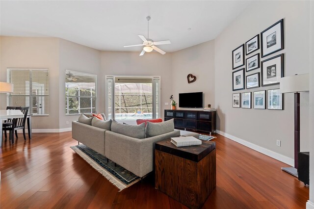 10030 Chatham Oaks Ct, Orlando, FL 32836 - living area featuring wood finished floors, a ceiling fan, and baseboards