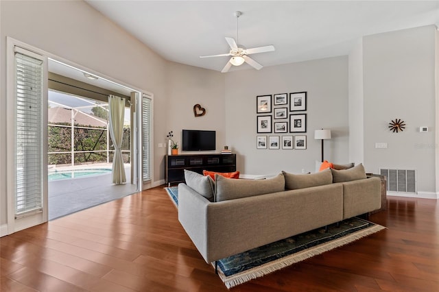 10030 Chatham Oaks Ct, Orlando, FL 32836 - living area featuring wood finished floors, a ceiling fan, and baseboards