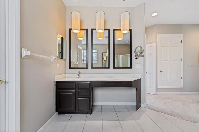 10030 Chatham Oaks Ct, Orlando, FL 32836 - bathroom with vanity, tile patterned flooring, and baseboards