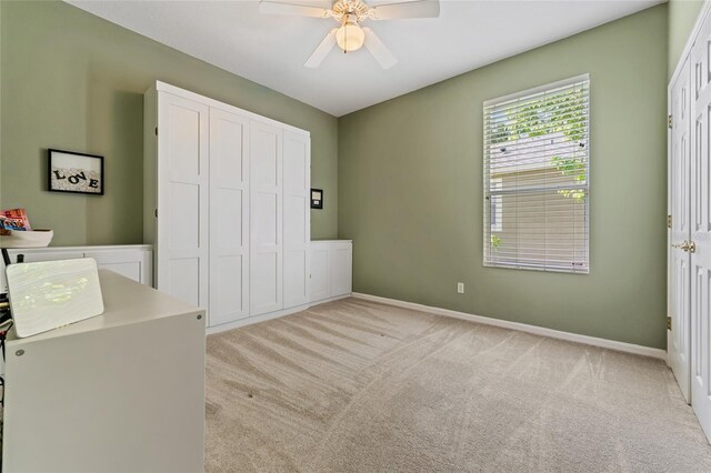 10030 Chatham Oaks Ct, Orlando, FL 32836 - unfurnished bedroom with light colored carpet, baseboards, a closet, and a ceiling fan