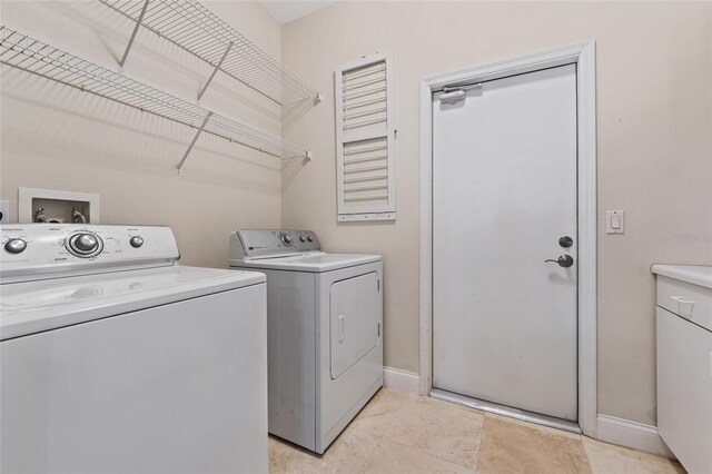 10030 Chatham Oaks Ct, Orlando, FL 32836 - washroom featuring washer and dryer and baseboards