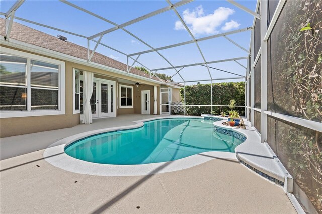 10030 Chatham Oaks Ct, Orlando, FL 32836 - outdoor pool with french doors, a patio area, and a ceiling fan