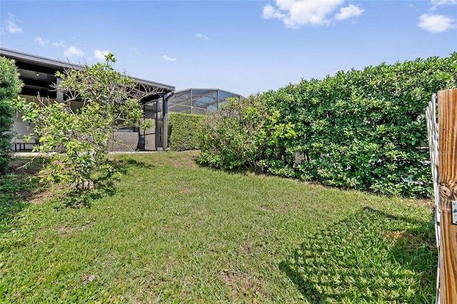 10030 Chatham Oaks Ct, Orlando, FL 32836 - view of grassy yard with a lanai