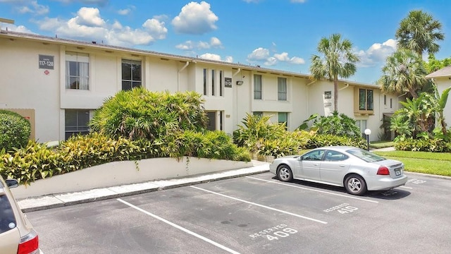 200 Maitland Ave Unit 122, Altamonte Springs, FL 32701 - view of building exterior with uncovered parking