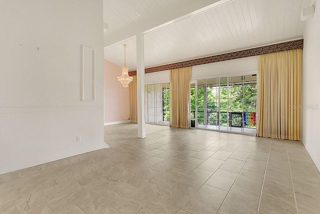 200 Maitland Ave Unit 122, Altamonte Springs, FL 32701 - spare room with a chandelier, baseboards, and beam ceiling
