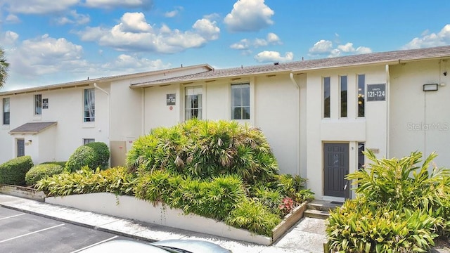 200 Maitland Ave Unit 122, Altamonte Springs, FL 32701 - view of front facade featuring stucco siding and uncovered parking