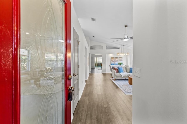 25 Reflections Village Dr, Ormond Beach, FL 32174 - foyer entrance with ceiling fan, vaulted ceiling, wood finished floors, and baseboards