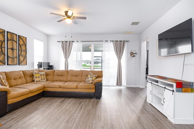 200 Summershore Dr, Auburndale, FL 33823 - living room featuring wood finished floors, ceiling fan, and baseboards