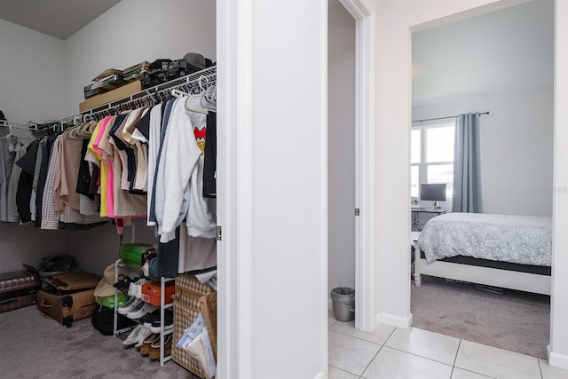 200 Summershore Dr, Auburndale, FL 33823 - spacious closet featuring carpet floors and tile patterned floors